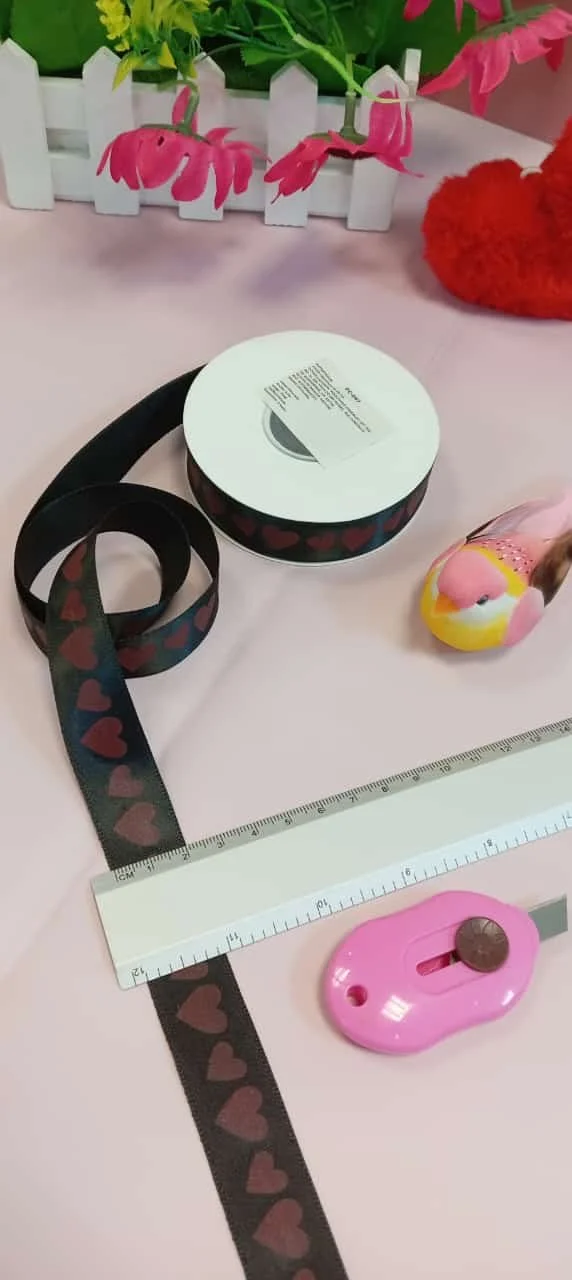 Ribbon with hearts, craft supplies, and decorative hearts for Listones Love crafts.